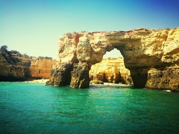 Scenic view of sea against clear blue sky