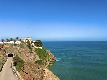 Scenic view of sea against clear blue sky