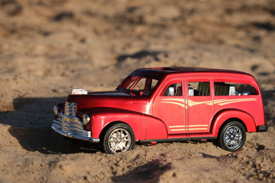 Red toy car on land