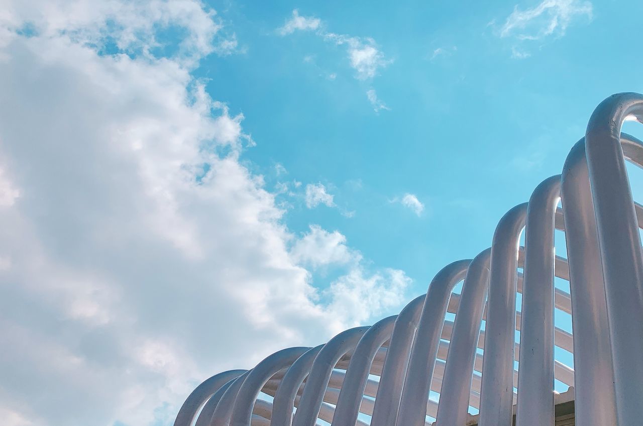 LOW ANGLE VIEW OF METAL STRUCTURE AGAINST CLOUDY SKY