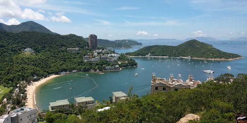 High angle view of bay and buildings against sky