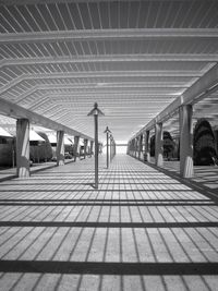 Empty road with lights in background