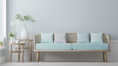 Empty chairs and table against wall at home
