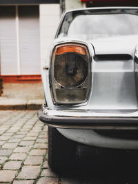 Close-up of vintage car parked on street