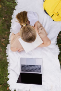 High angle view of woman using mobile phone