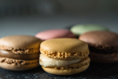 Fresh crunchy macaroons on table