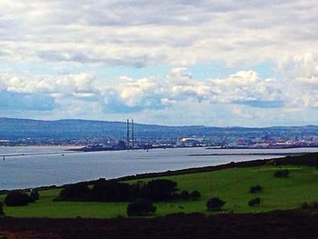 Scenic view of landscape against cloudy sky