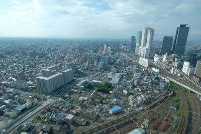 High angle view of modern buildings in city against sky