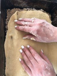 High angle view of hand preparing food