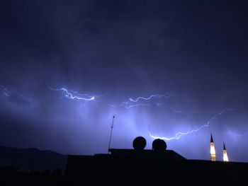 Low angle view of silhouette lightning against sky