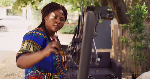 Side view of young woman using mobile phone