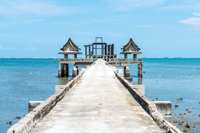 Pier over sea against sky