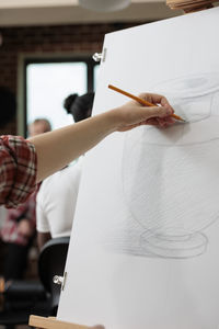 Midsection of man working at table