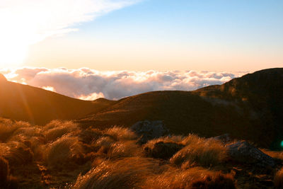 Scenic view of mountains against sky during sunset