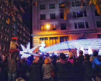 Crowd on street in city at night