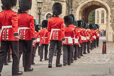 Rear view of army soldiers standing at castle