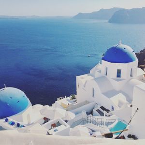 Panoramic view of sea and buildings against sky in santorini 