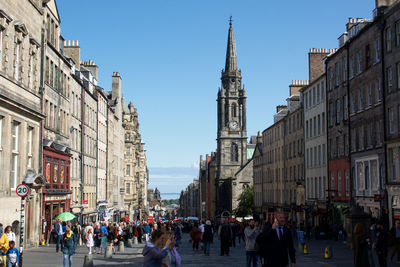 Group of people walking on city street