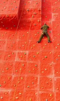 Close-up of man on climbing wall