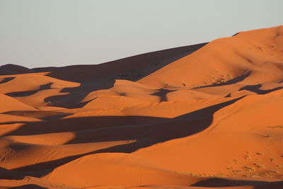 Scenic view of desert against clear sky