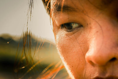 Close-up of sweaty woman looking away