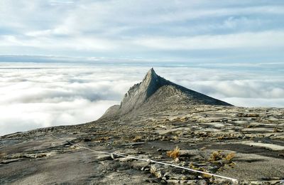 Scenic view of mount kinabalu against cloudy sky