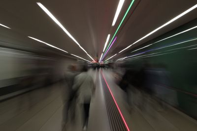 Blurred motion of people at subway station