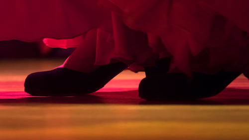 Low section of female dancer dancing on stage