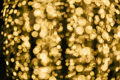 Defocused image of illuminated christmas tree