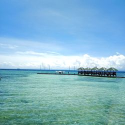 Scenic view of sea against blue sky