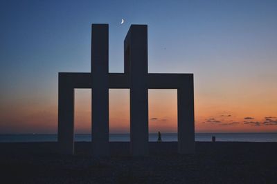 Scenic view of beach against sky during sunset