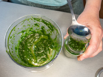 High angle view of hand holding drink