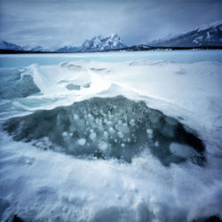 Close-up of frozen sea against sky