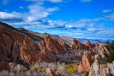 Panoramic view of desert against cloudy sky