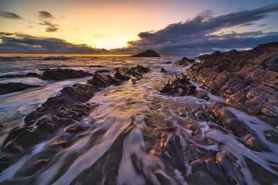 Scenic view of sea against sky during sunset