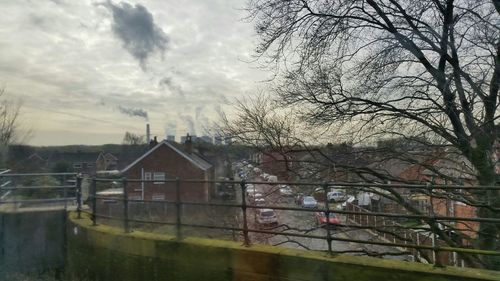 Buildings against cloudy sky