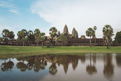 Reflection of temple and trees in lake