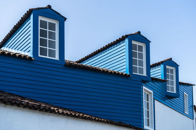 Low angle view of building against blue sky