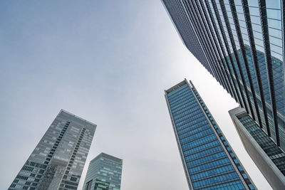 Low angle view of modern buildings against clear sky