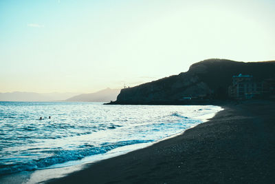 Scenic view of sea against clear sky during sunset