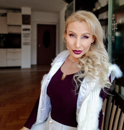 Portrait of woman standing at home