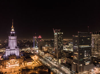 Illuminated buildings in city at night