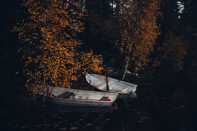 View of two row boats at sea during autumn