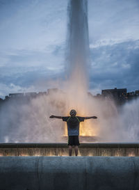 Silhouette of man standing against cloudy sky