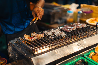 Midsection of man preparing food