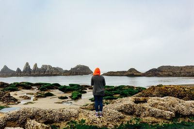 Silhouette of man standing on cliff