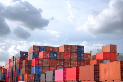 Stack of commercial dock against sky