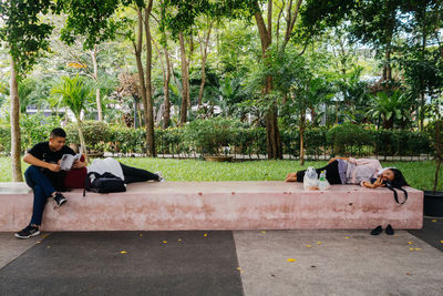 People sitting on bench in park