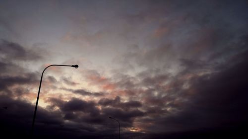 Low angle view of cloudy sky at sunset