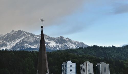 Scenic view of snow covered mountains against sky